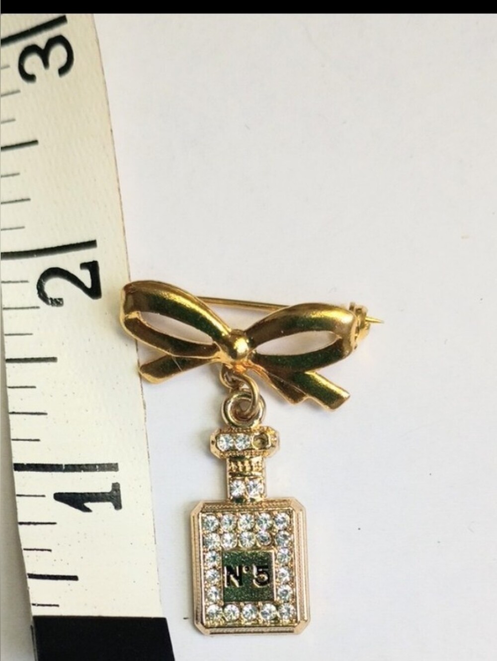 Gold Bow Brooch with Crystal-Encrusted Perfume Bottle Charm (Nº5) - Picture 7 of 10
